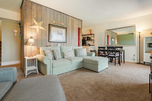 34 Weetamoo Trl Unit 5, Campton, NH 03223 - living area featuring carpet flooring, wood walls, and baseboards