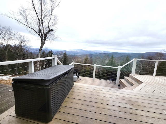 wooden terrace featuring a mountain view