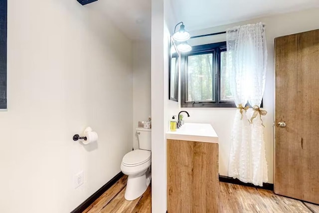 18 Crow Ln, Conway, NH 03818 - bathroom with toilet, vanity, and wood finished floors