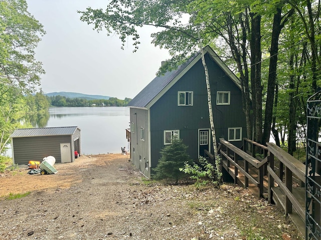 18 Crow Ln, Conway, NH 03818 - back of house featuring a water view and an outdoor structure