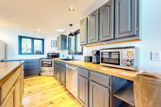 18 Crow Ln, Conway, NH 03818 - kitchen with stainless steel appliances, a sink, butcher block counters, light wood-style floors, and recessed lighting