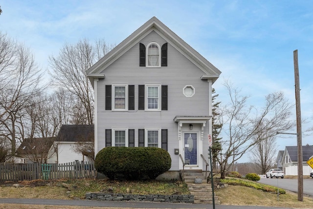 neoclassical / greek revival house with fence and entry steps