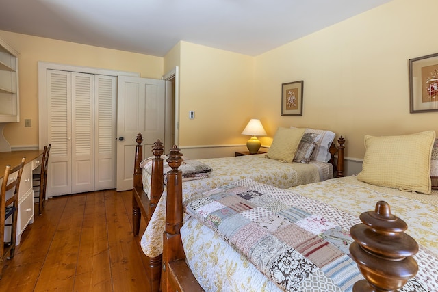 bedroom with a closet and hardwood / wood-style flooring