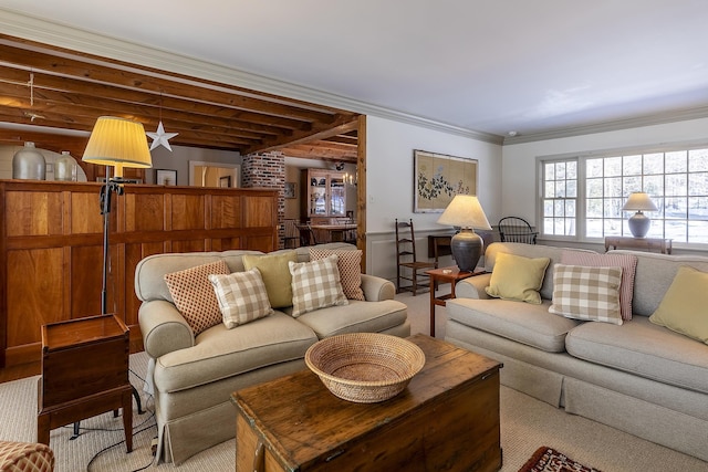living area featuring ornamental molding and carpet flooring
