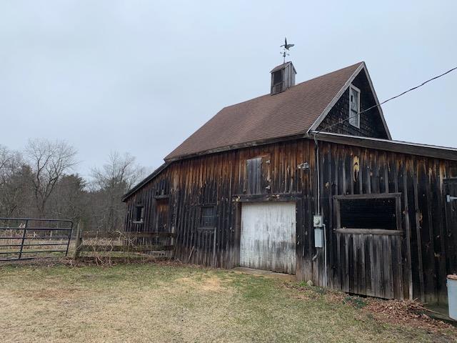 1747 River Rd, Weare, NH 03281 - view of barn featuring fence and a yard