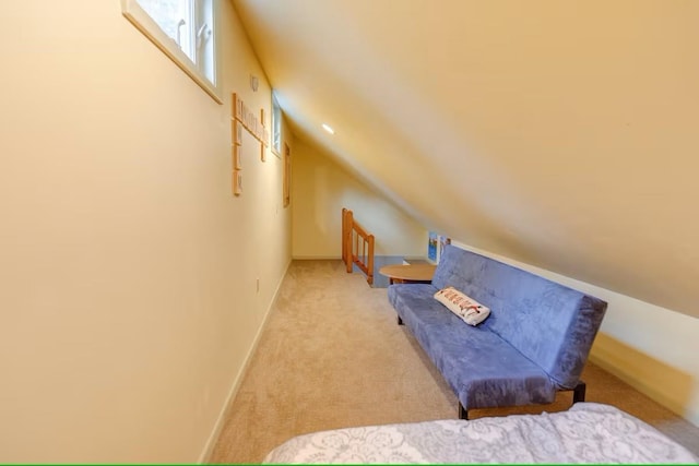 bedroom with baseboards, carpet flooring, and vaulted ceiling