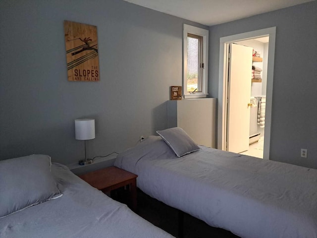 bedroom featuring a baseboard heating unit