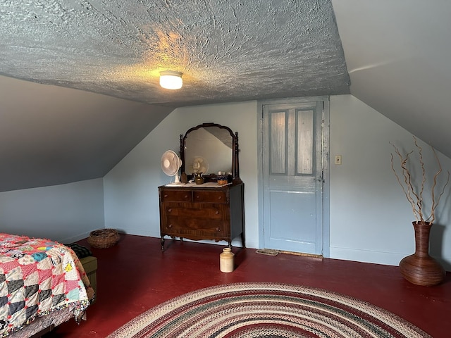 107 Ainsworth Rd, Woodbury, VT 05681 - bedroom with vaulted ceiling, baseboards, and a textured ceiling