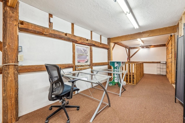unfurnished office with carpet floors and a textured ceiling