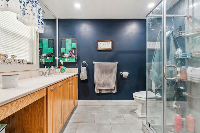 full bathroom with tile patterned floors, toilet, a shower stall, and vanity