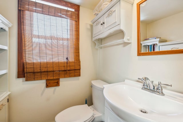 bathroom with a sink and toilet