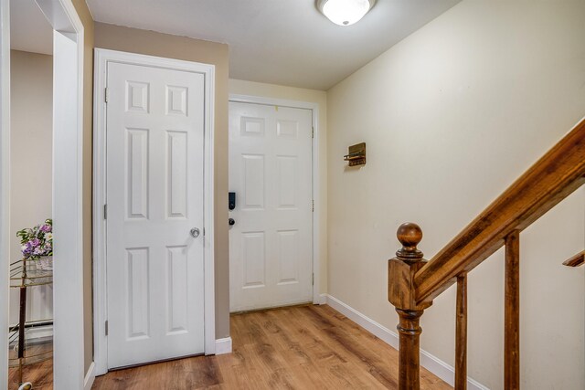 114 Winterwood Dr Unit 114, Londonderry, NH 03053 - entrance foyer featuring baseboards and light wood finished floors