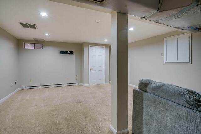 114 Winterwood Dr Unit 114, Londonderry, NH 03053 - finished below grade area with visible vents, baseboards, baseboard heating, recessed lighting, and light colored carpet