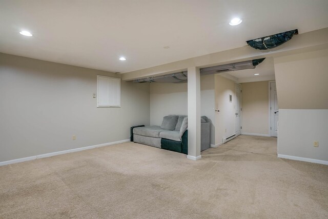 114 Winterwood Dr Unit 114, Londonderry, NH 03053 - finished below grade area featuring baseboards, recessed lighting, visible vents, a baseboard radiator, and light colored carpet