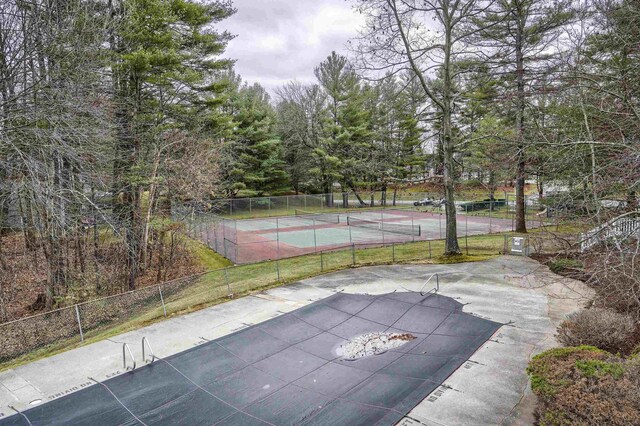 114 Winterwood Dr Unit 114, Londonderry, NH 03053 - view of sport court featuring fence