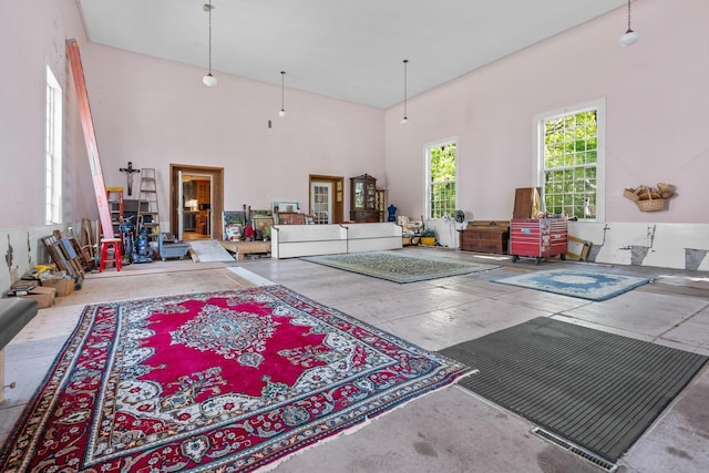 living room with a high ceiling