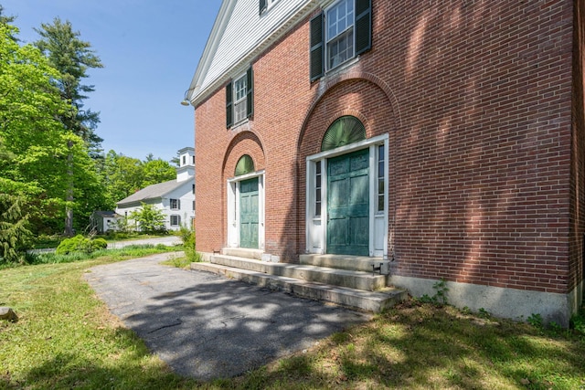 entrance to property with brick siding