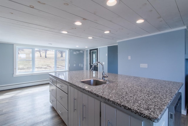 849 Mount Bess Rd, Charleston, VT 05872 - kitchen with recessed lighting, a kitchen island with sink, light wood-style floors, and a sink