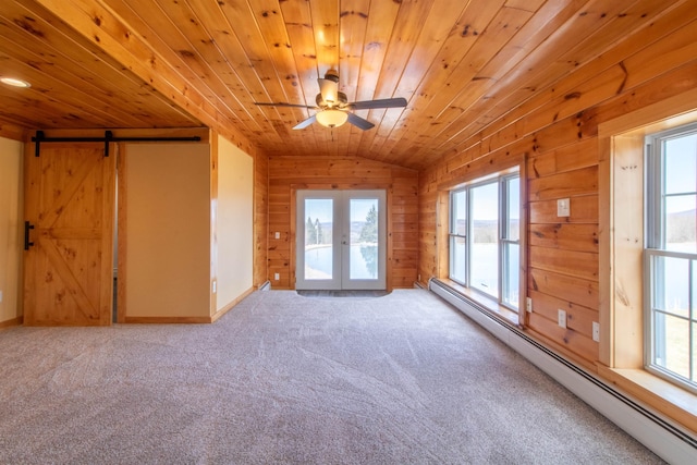 849 Mount Bess Rd, Charleston, VT 05872 - unfurnished room featuring vaulted ceiling, a ceiling fan, wood walls, a baseboard radiator, and wooden ceiling