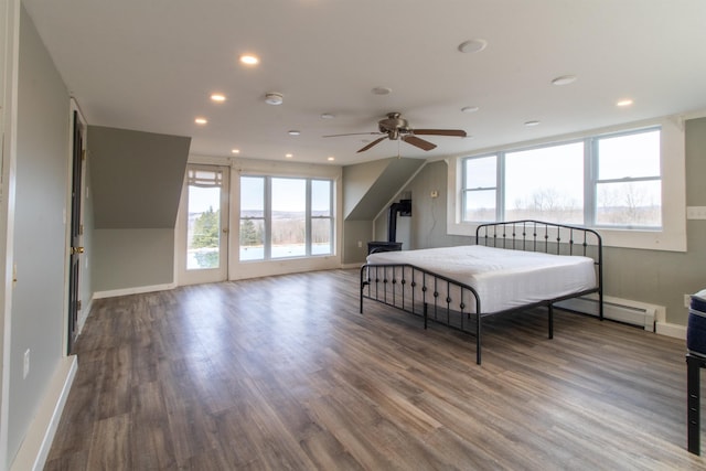 849 Mount Bess Rd, Charleston, VT 05872 - bedroom with a baseboard heating unit, baseboards, recessed lighting, access to exterior, and wood finished floors