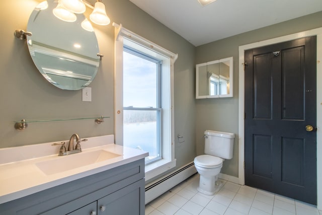 849 Mount Bess Rd, Charleston, VT 05872 - bathroom with vanity, toilet, tile patterned flooring, and baseboard heating