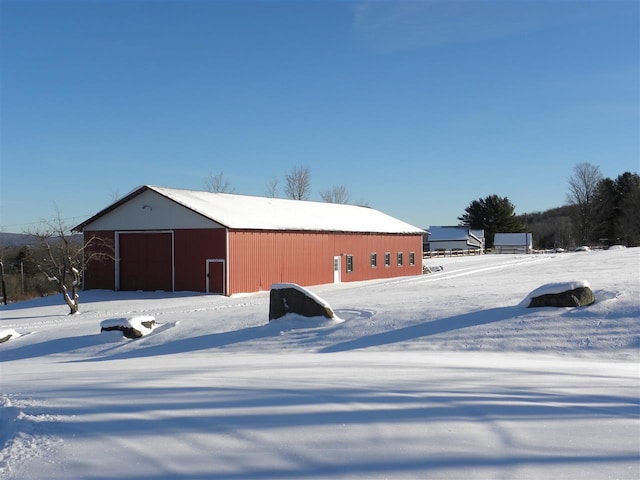 849 Mount Bess Rd, Charleston, VT 05872 - snow covered structure with an outbuilding and a pole building