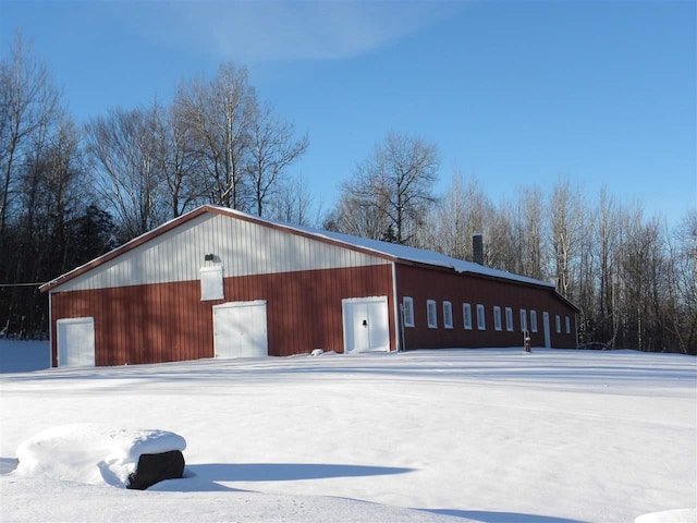 849 Mount Bess Rd, Charleston, VT 05872 - snow covered garage featuring a garage
