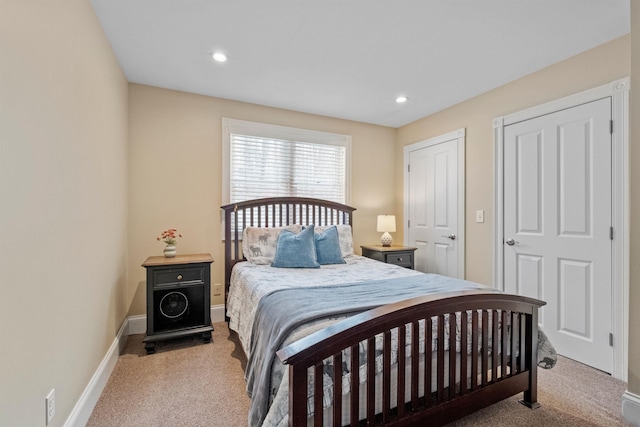carpeted bedroom with baseboards and recessed lighting