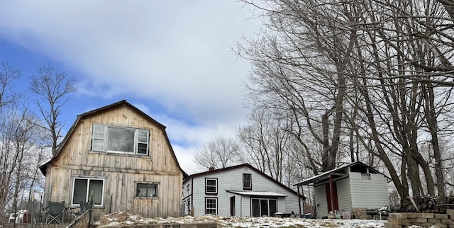 rear view of house with a gambrel roof