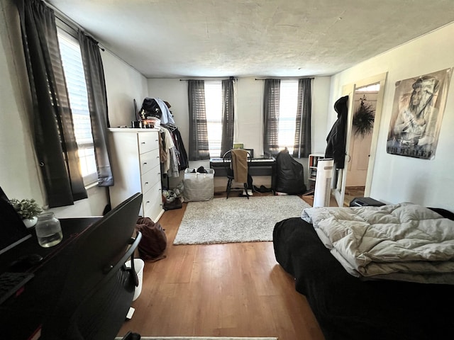 bedroom with wood finished floors