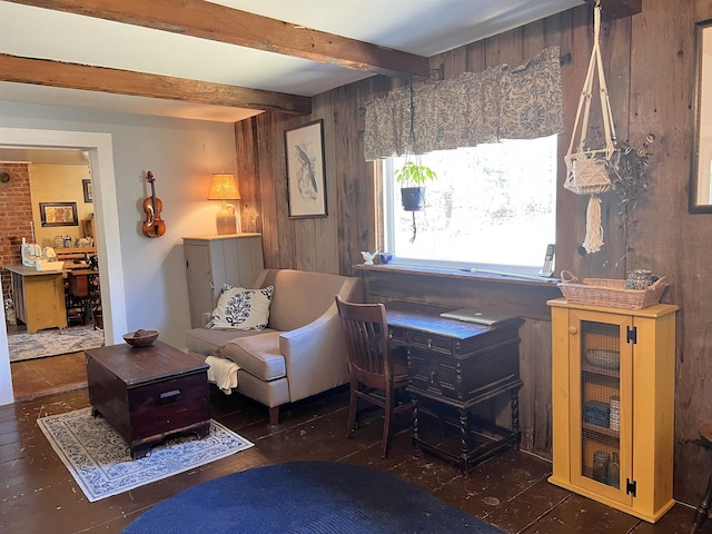 office area with wood walls and beamed ceiling