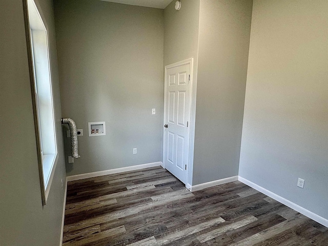 washroom with dark wood-style flooring, baseboards, hookup for a washing machine, and laundry area