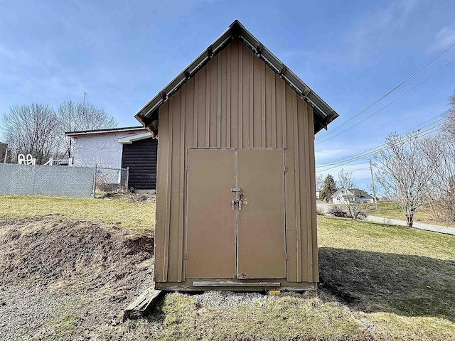 view of shed with fence