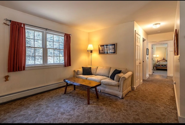 living area featuring a baseboard heating unit and carpet floors