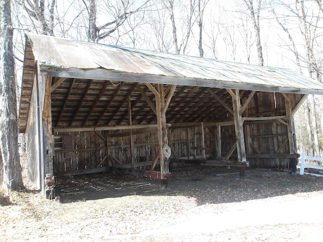 surrounding community featuring a detached carport, a pole building, and an outdoor structure