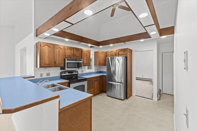 1 Pine Grove Ter, Winooski, VT 05404 - kitchen with a sink, brown cabinetry, appliances with stainless steel finishes, and baseboard heating