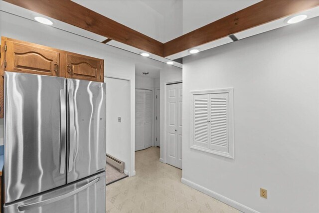 1 Pine Grove Ter, Winooski, VT 05404 - kitchen featuring baseboards, a baseboard radiator, freestanding refrigerator, brown cabinets, and recessed lighting