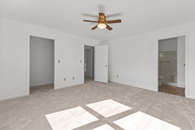 1 Pine Grove Ter, Winooski, VT 05404 - unfurnished bedroom featuring baseboards, a ceiling fan, carpet, and connected bathroom