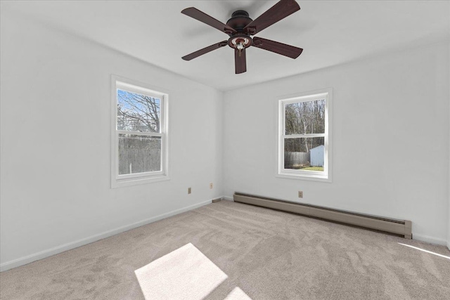1 Pine Grove Ter, Winooski, VT 05404 - empty room with a baseboard radiator, a ceiling fan, carpet, and baseboards
