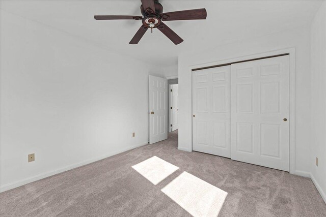 1 Pine Grove Ter, Winooski, VT 05404 - unfurnished bedroom with ceiling fan, a closet, carpet flooring, and baseboards