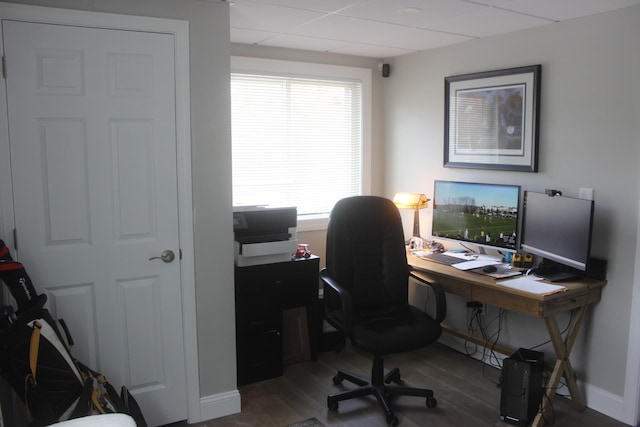 office featuring baseboards, wood finished floors, and a drop ceiling