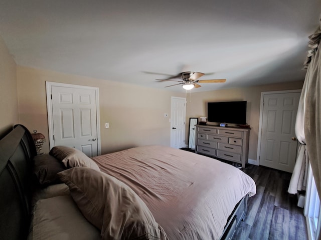 bedroom featuring dark wood-style floors and ceiling fan