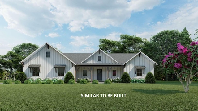 view of front facade with board and batten siding and a front lawn