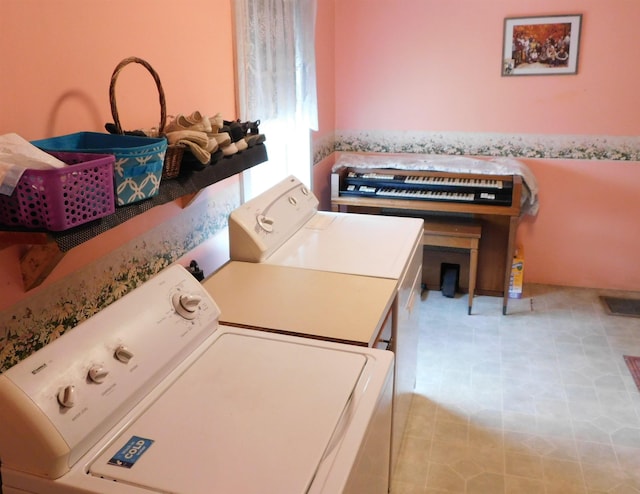 washroom featuring visible vents, washer and dryer, laundry area, and light tile patterned floors