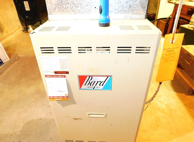 interior details featuring concrete flooring and heating unit