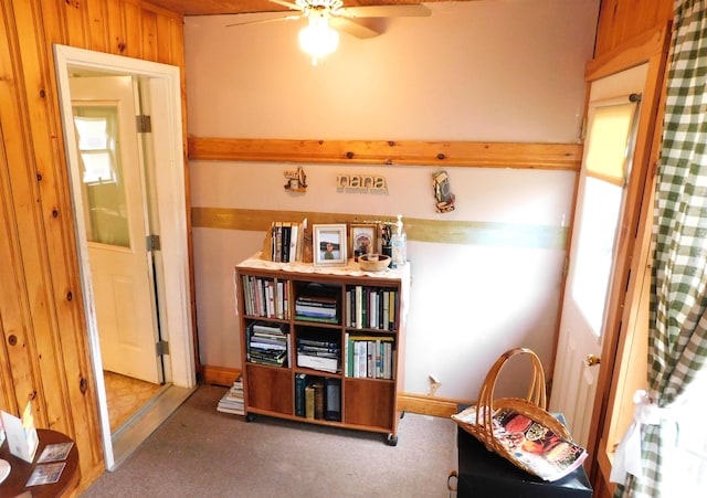 sitting room with carpet flooring and a ceiling fan