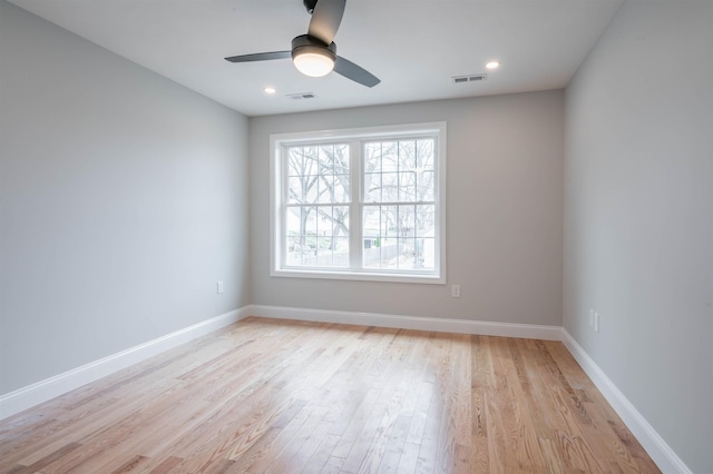 43 Laton St Unit A, Nashua, NH 03064 - empty room with light wood-style floors, visible vents, and ceiling fan