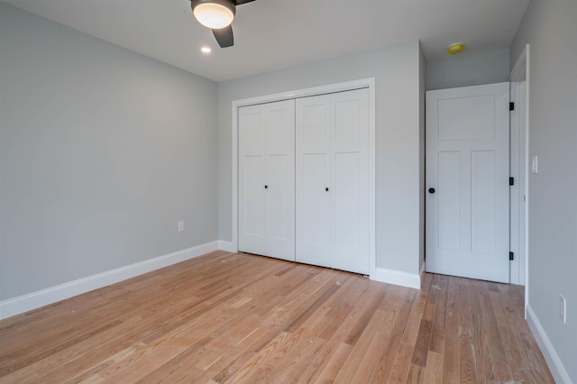 43 Laton St Unit A, Nashua, NH 03064 - unfurnished bedroom with light wood-type flooring, a closet, a ceiling fan, recessed lighting, and baseboards