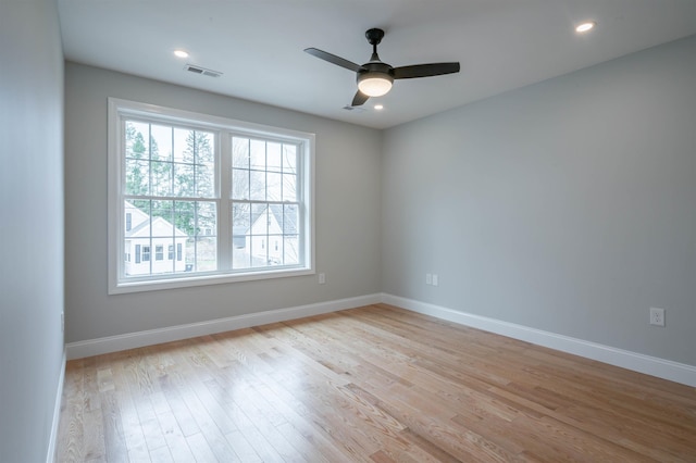 43 Laton St Unit A, Nashua, NH 03064 - unfurnished room with visible vents, baseboards, light wood finished floors, and a ceiling fan