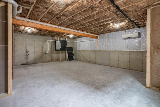 43 Laton St Unit A, Nashua, NH 03064 - unfinished below grade area with an AC wall unit and electric panel